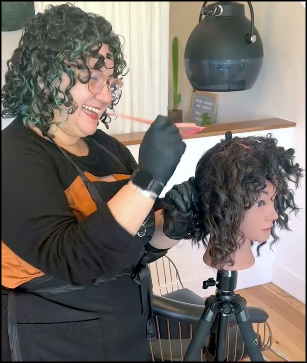 Love practices applying hair color during her salon apprenticeship.